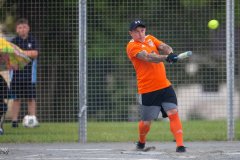 Ross Machon hits as the rain begins to fall